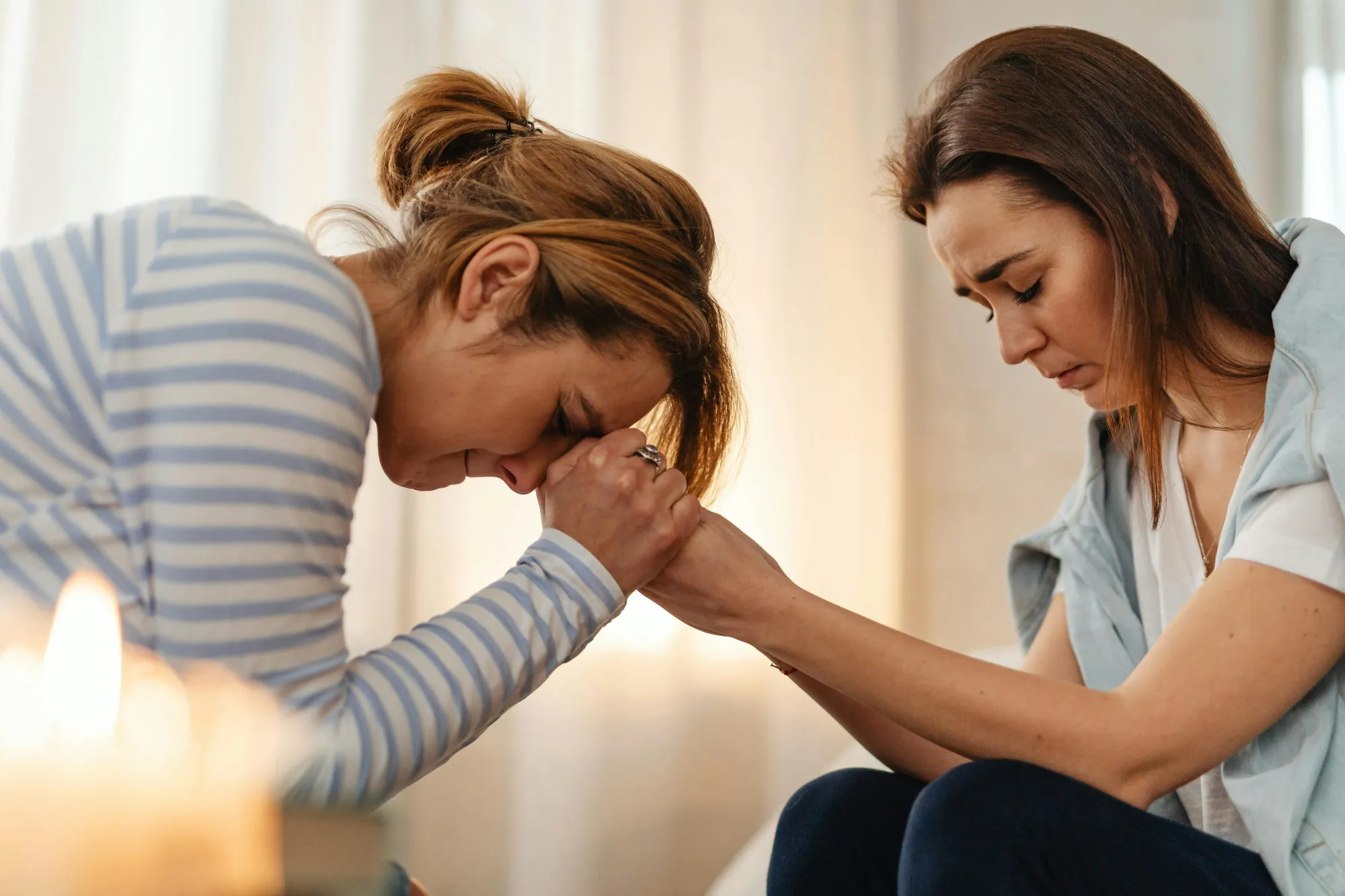 Hands clasped together in prayer